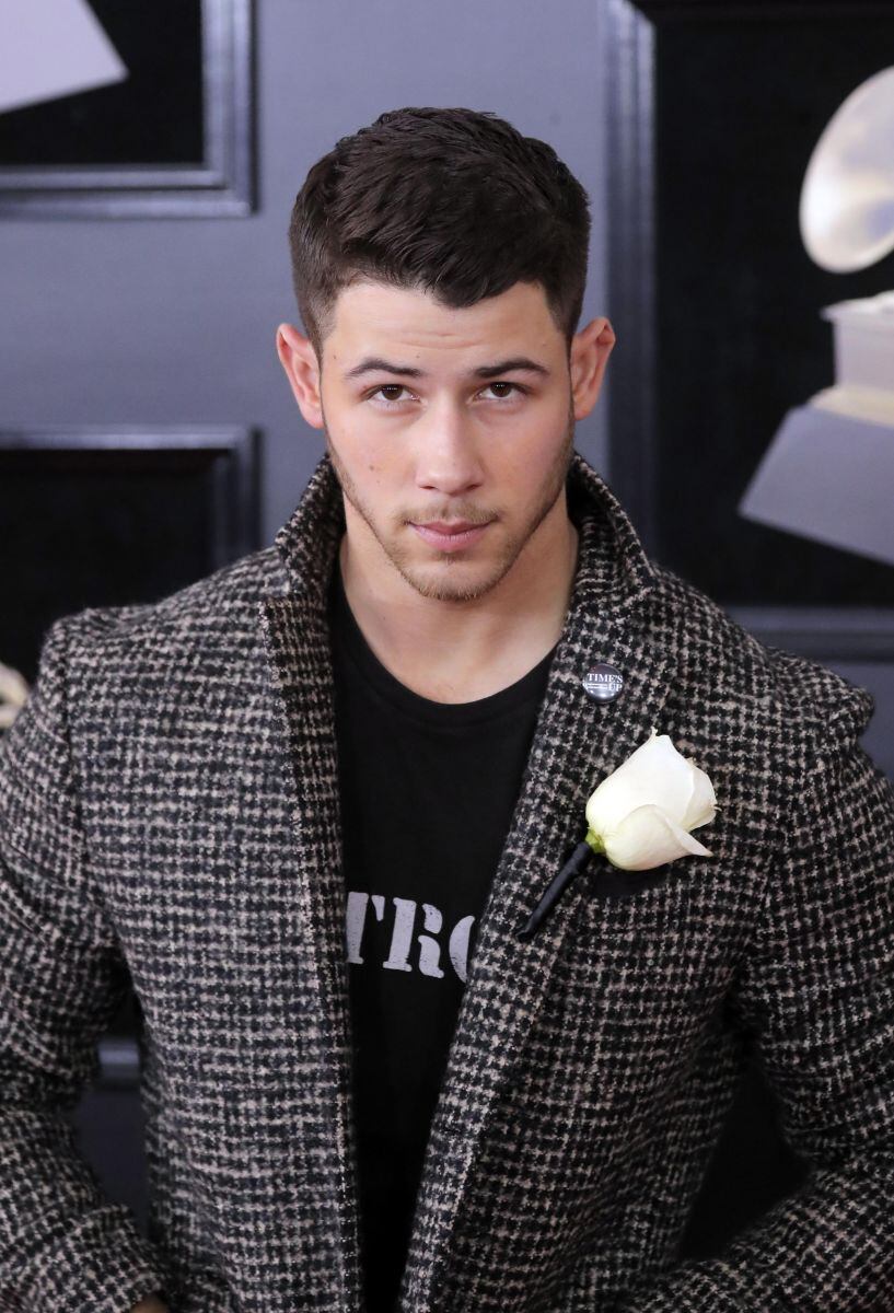 Ellos portaron una rosa blanca por #MeToo en los Grammy