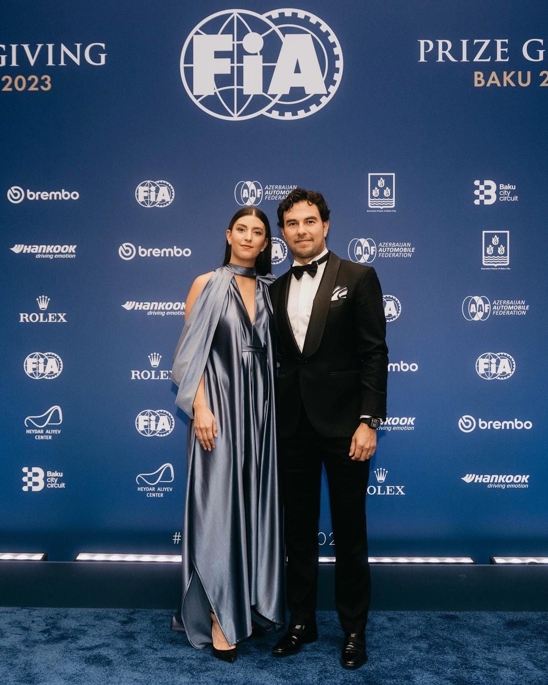 Carola Martínez y Checo Pérez/Instagram: @redbullracing